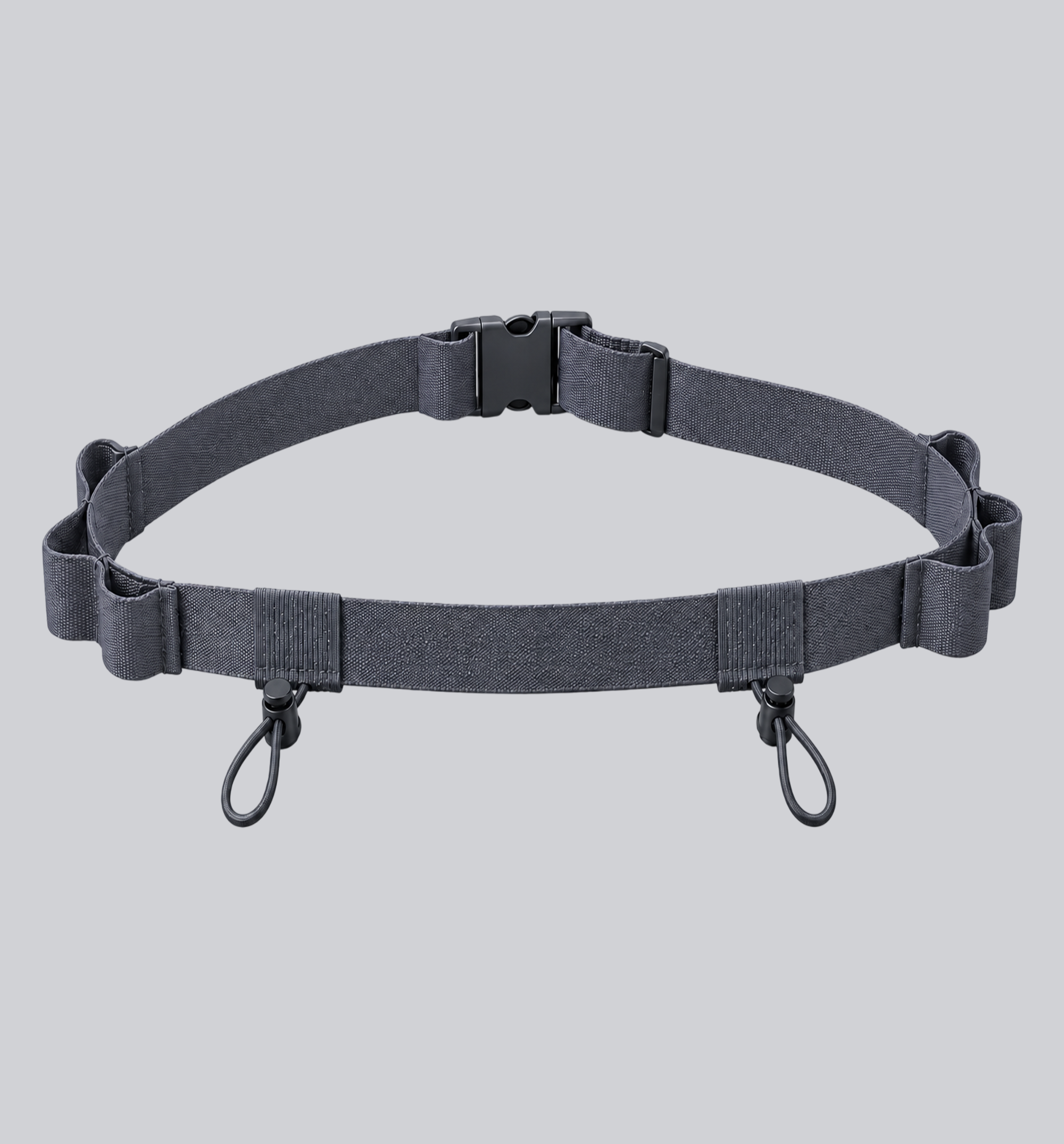 Charcoal grey Race Bib Belt Pro with adjustable buckle, bib attachment loops, and elastic race essentials chambers on a soft grey background.
