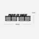 Proof of Sweat black metal medal hanger display unit showing 18 inch width and 5 inch height dimensions