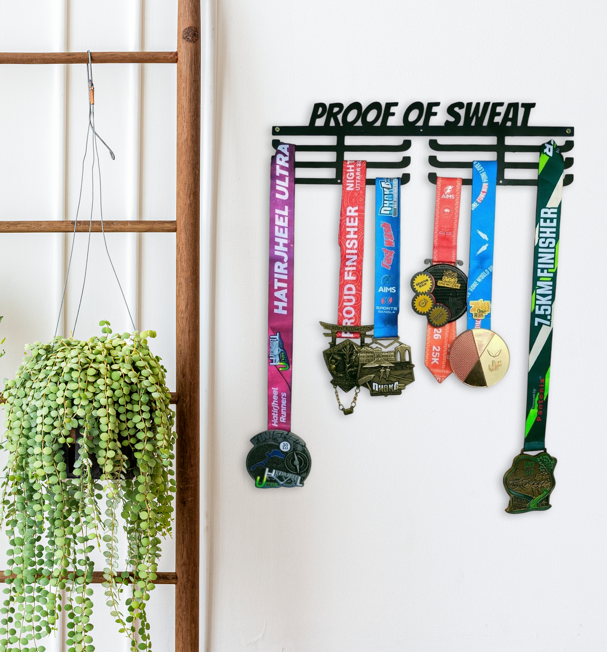 Proof of Sweat black metal medal hanger display unit showing 18 inch width and 5 inch height dimensions